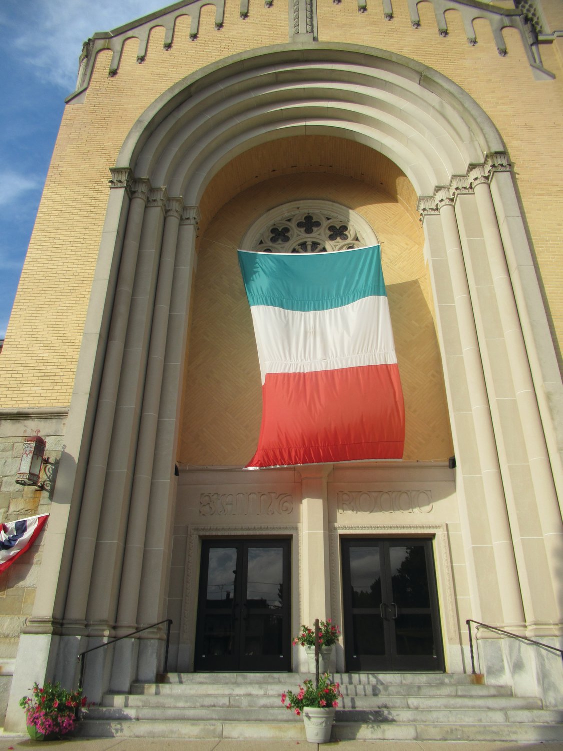 FAMOUS FLAG. This is the Italian flag that hangs above the main entrance to St. Rocco’s Church on Atwood Avenue and for years has been a signature sign for the annual feast and festival.